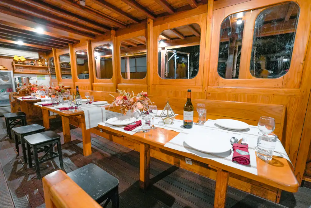 Andamari Phinisi Boat Charter | Andamari Indoor Dining Area | Boat Komodo Trip