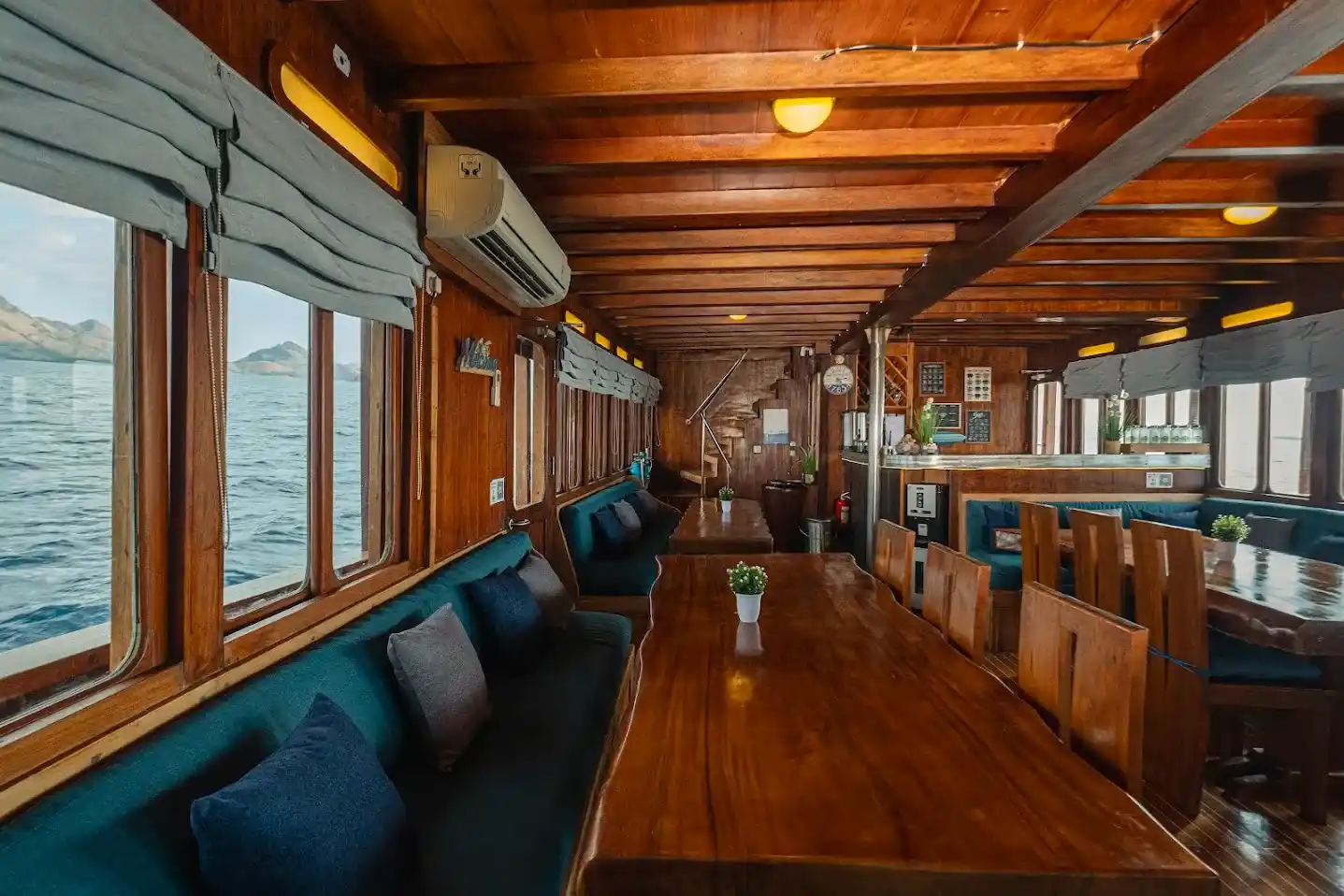 Indoor Dining Area on Cajoma V Phinisi Boat Charter | Liveaboard | Komodo Tour | Boat Komodo Trip