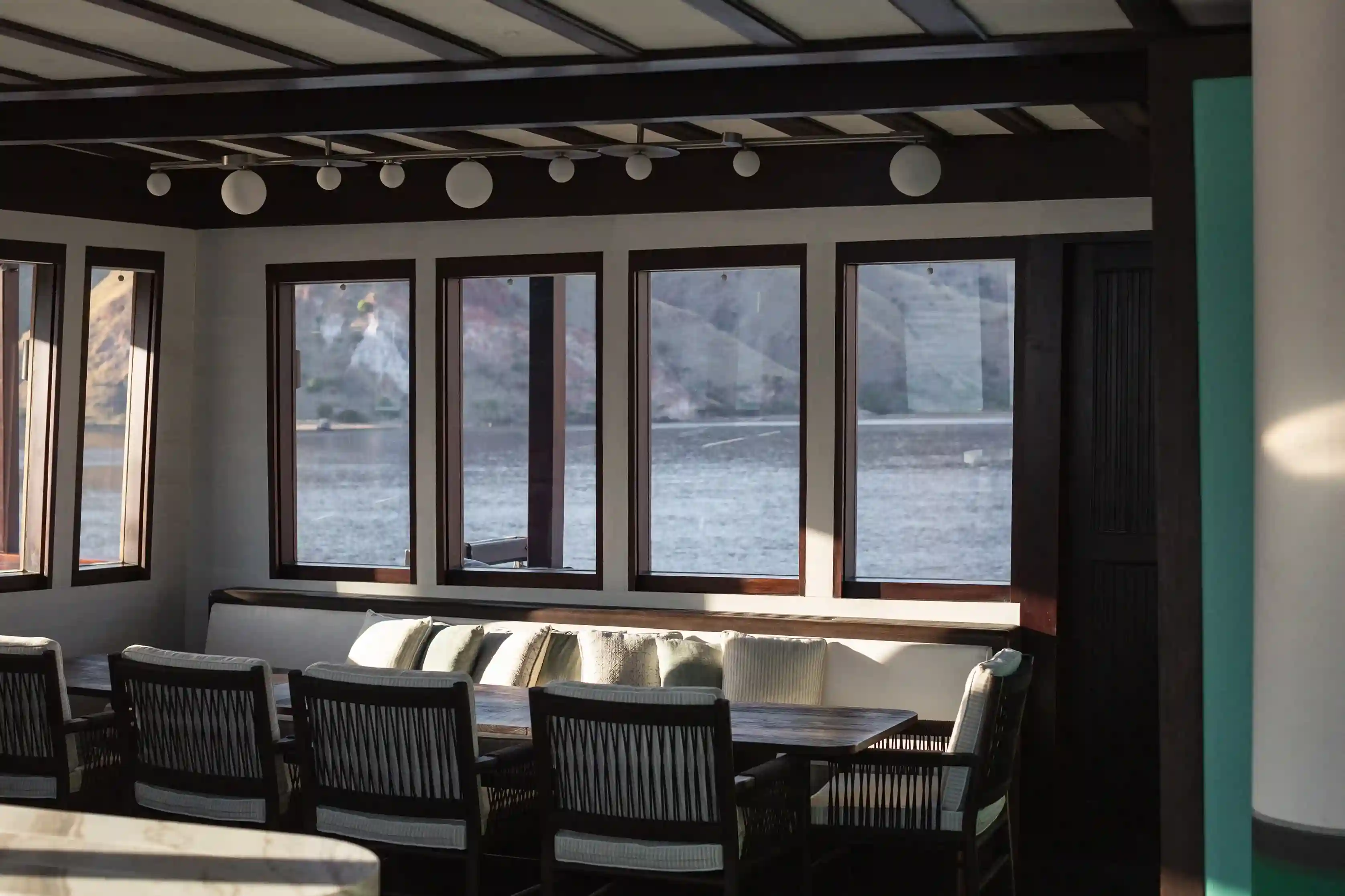 Indoor Dining Areas | Vela Phinisi Boat Charter | Boat Komodo Trip